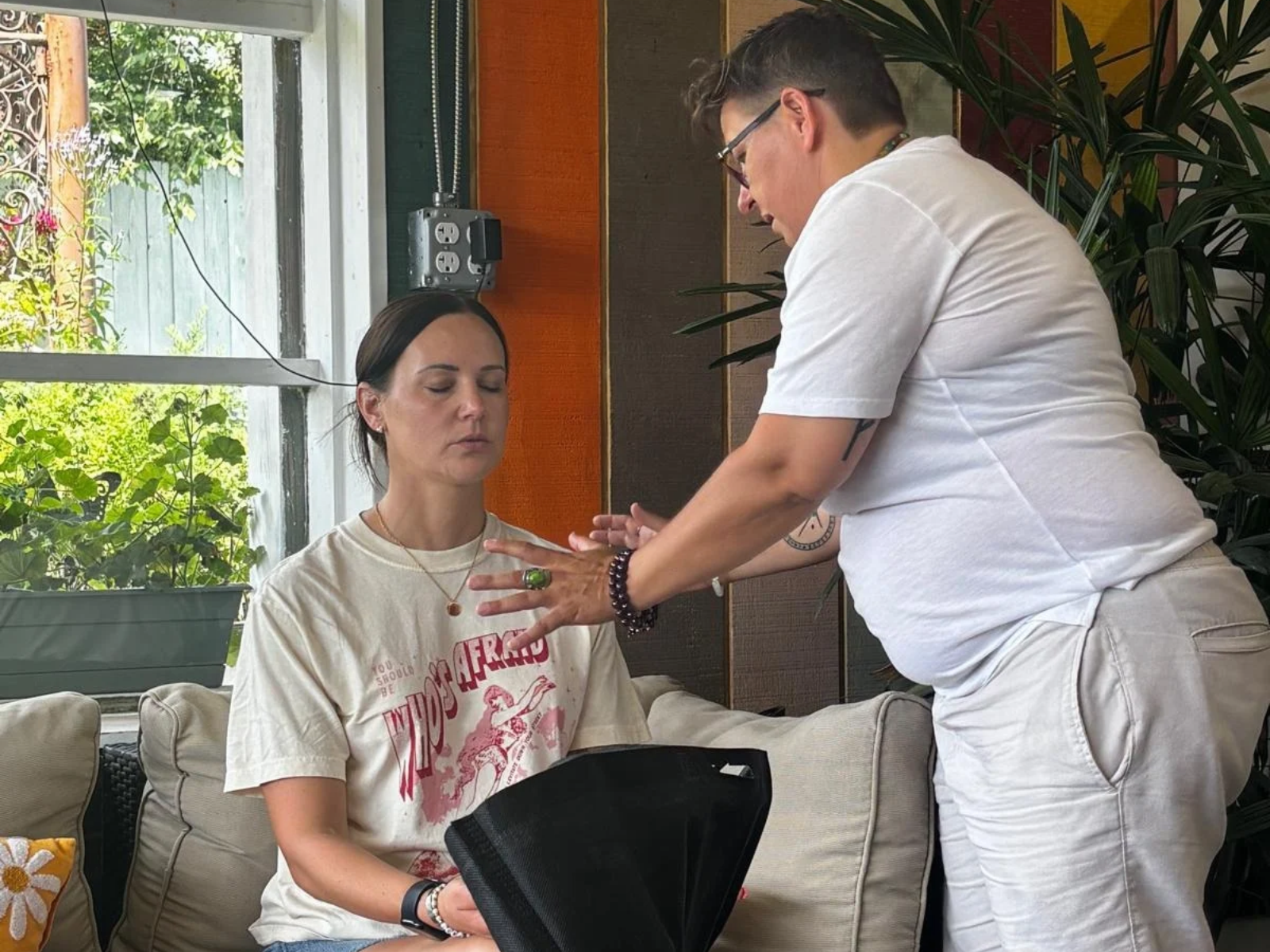 Selda Turker working with a participant during a wellness session